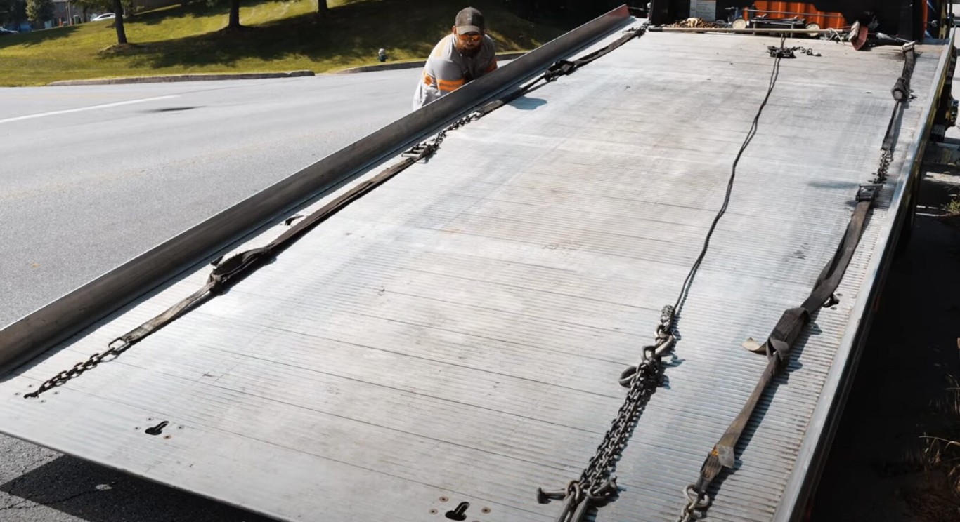 Secure flatbed towing equipment and chains ready for vehicle transport